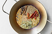 Curry powder – nuts, seeds and dried herbs being toasted