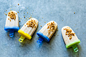 Soya ice cream sticks with sesame seed brittle