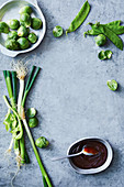 Spring onions, brussels sprouts, mangetout and hoisin sauce