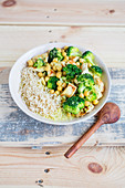 Chickpea curry with chicken and broccoli served with rice (Asia)