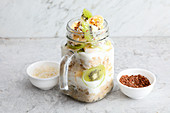 Overnight coconut oats with kiwi and flax seeds