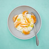 Soya quark cream with pineapple, mandarins and coconut flakes