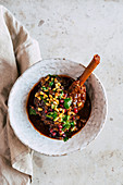 Dukkah-roasted lamb shanks with pine nuts and sultana salsa