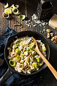 Vegetarian leek, blue cheese and walnut risotto in a pan