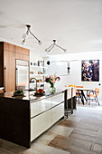 Kitchen island in front of dining area in open-plan interior