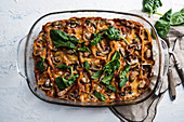 Vegan spinach and mushroom lasagna in a casserole dish