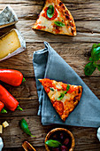 Pizza with cheese, tomatoes and basil