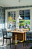 Wooden table in vintage conservatory