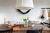 Wintry arrangement on dining table in kitchen-dining room