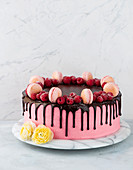 Raspberry cake with macarons