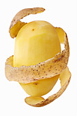 A peeled potato with potato peel