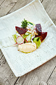 Salted beetroot with goat's cream cheese and radishes