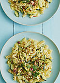 Fusilli with a courgette and cream sauce and pistachio nuts