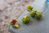 Fresh figs on a grey surface