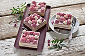 Vegan no-bake vanilla and raspberry cheesecake with chocolate topping and cream tuffs