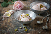 Bowls of Cardamon and Rose Ice Cream on a Rustic Board