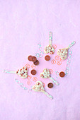 Raspberry and coconut hearts on sticks