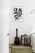 Message about guitar and bedside table in the bedroom