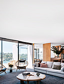 Modern living room in natural tones with panoramic views