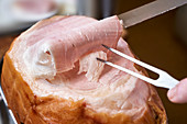 A ham joint being carved