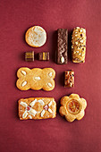 Various gingerbread biscuits on red paper
