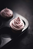 Vegan chocolate cupcakes with raspberry cream frosting