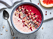A smoothie bowl with beetroot and grapefruit