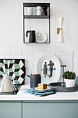 Designer-style kitchen accessories in kitchen decorated in blue, white and grey