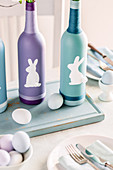 Painted bottles decorated with Easter bunnies