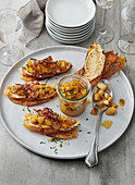 Crostini with preserved pears and bacon