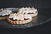 Berry tartlets with meringue dots