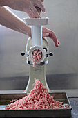 Meat being minced
