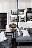 Photo wall with black and white photos in the monochrome living room
