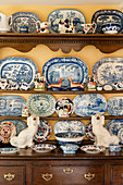 Collection of crockery and china figurines on old dresser