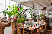 Set table decorated with bizarre curiosities in former factory sales area