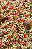 Tabbouleh with salad servers