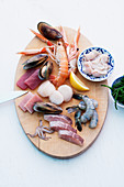 Sliced fish, seafood and mussels for a fondue