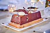 Chocolate terrine on puff pastry for Christmas