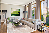 Grey sofa set, coffee table and minibar in elegant living room