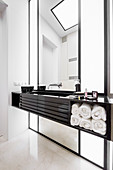 Floating washstand and marble floor in elegant bathroom