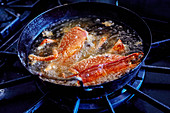 Crayfish in simmering oil
