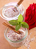 Homemade oriental rose and cinnamon salt with fresh rose petals and mint