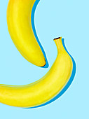 Bananas on a light blue surface