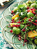 Brussels sprouts salad with orange and pomegranate seeds