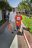 Blind Teen Practices with White Cane