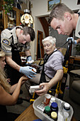 Paramedics Check Elderly Patient's Medications