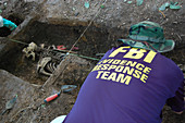 FBI ERT Agent Excavating Human Remains, 2009