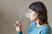 Woman using electronic cigarette
