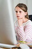 8 year-old girl using a computer
