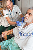 Occupational therapist shaving patient